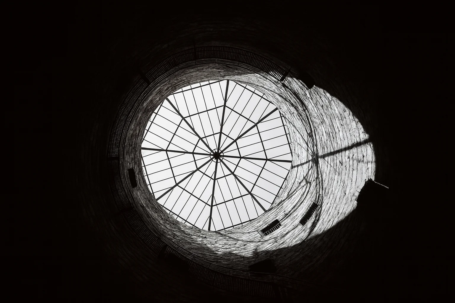 Upward View of Dome Opening in Historic Stone Structure – Black and White Architectural Composition
