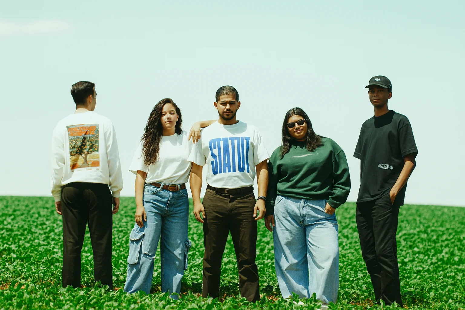 Young Group Posing Together in an Open Field