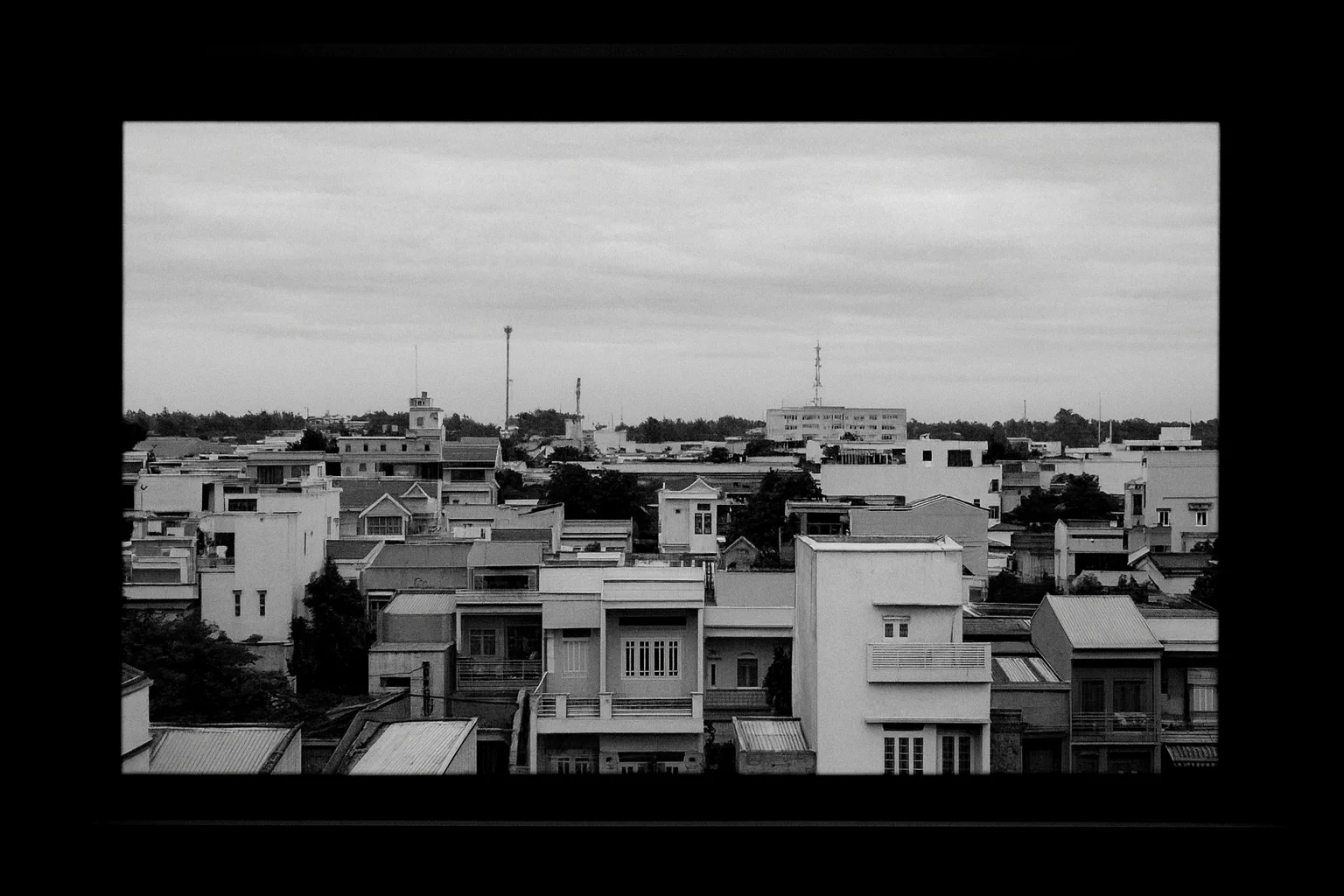 Black and White Cityscape Seen Through a Window